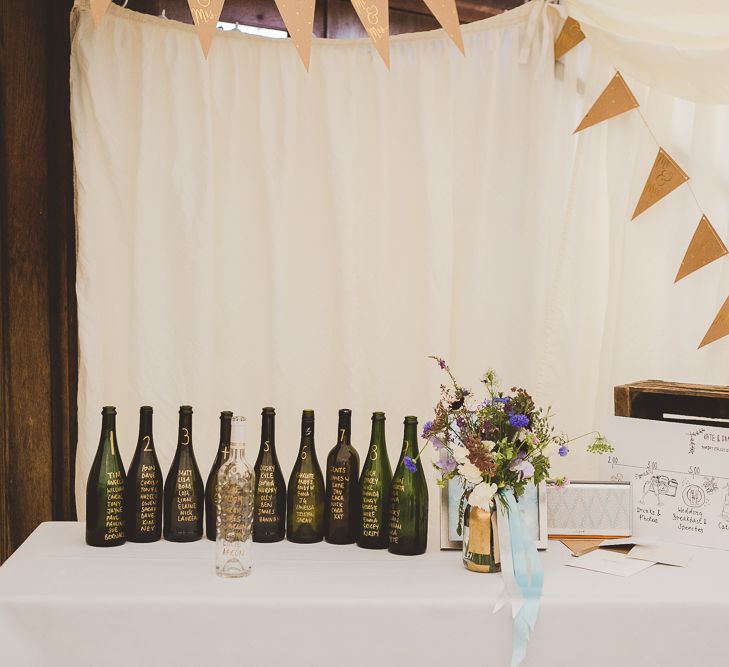 Bottle Table Plan & Bunting Wedding Decor | Outdoor Ceremony at Sulgrave Manor Northamptonshire | Nicola Casey Photography