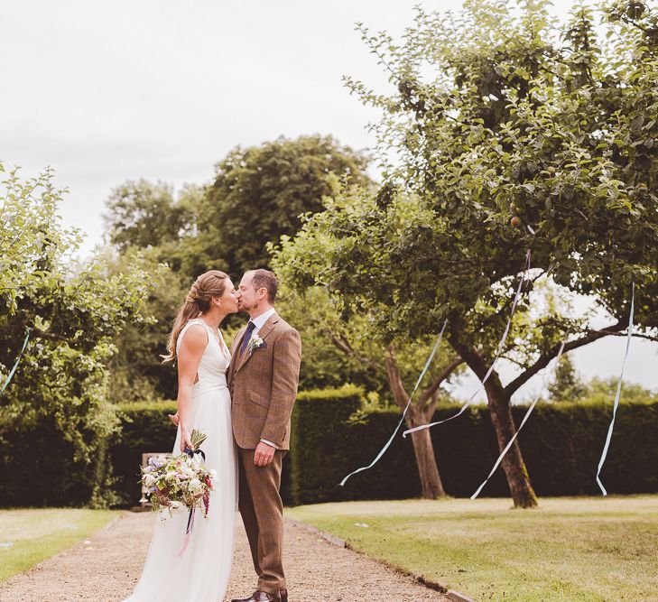 Bride in Charlie Brear Gown | Groom in Tweed Suit | Outdoor Ceremony at Sulgrave Manor Northamptonshire | Nicola Casey Photography