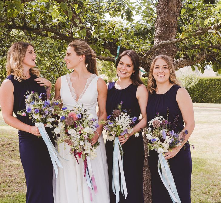 Bridal Party | Bride in Charlie Brear Gown | Bridesmaids in Navy Phase Eight Dresses | Outdoor Ceremony at Sulgrave Manor Northamptonshire | Nicola Casey Photography