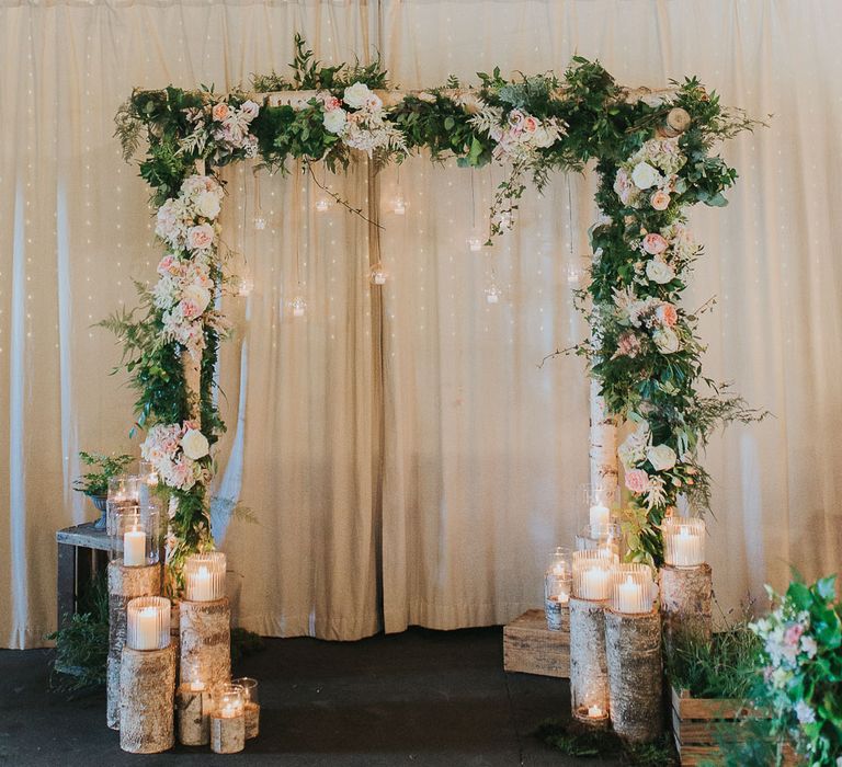 Wooden Arch with Floral Decor | Altar Decor | Pink & Gold Summer Wedding at East Riddlesden Hall Barn, Wiltshire | Laura Calderwoods Photography