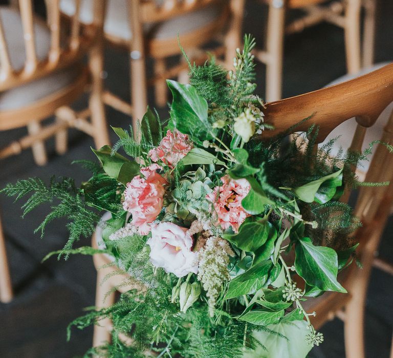 Flower & Foliage Aisle Chair Decor | Pink & Gold Summer Wedding at East Riddlesden Hall Barn, Wiltshire | Laura Calderwoods Photography