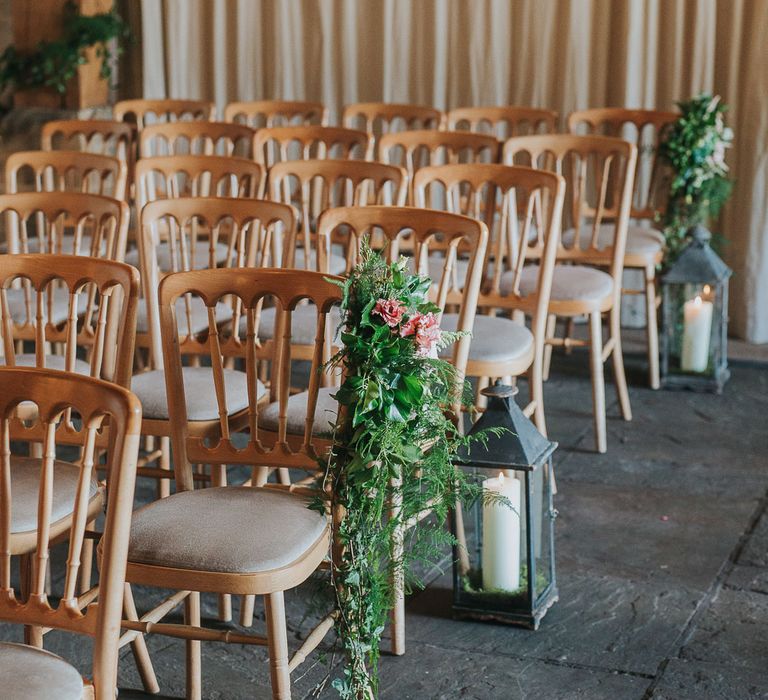 Flower & Foliage Aisle Chair Decor & Lanterns | Pink & Gold Summer Wedding at East Riddlesden Hall Barn, Wiltshire | Laura Calderwoods Photography