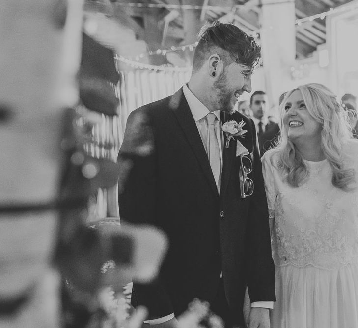 Wedding Ceremony | Bride in Custom Made Separates | Groom in Navy Next Suit & Pie Tie | Pink & Gold Summer Wedding at East Riddlesden Hall Barn, Wiltshire | Laura Calderwoods Photography