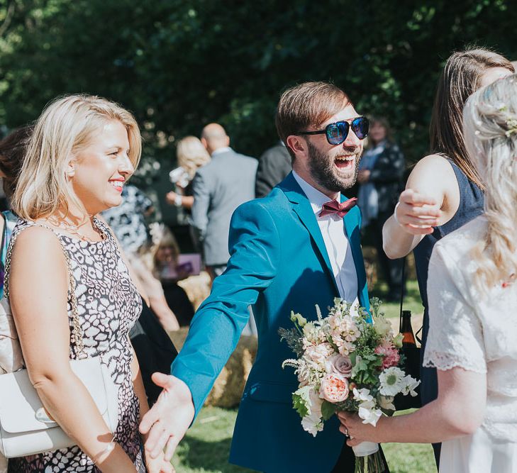 Wedding Guest Hugs | Bride in Custom Made Separates | Pink & Gold Summer Wedding at East Riddlesden Hall Barn, Wiltshire | Laura Calderwoods Photography