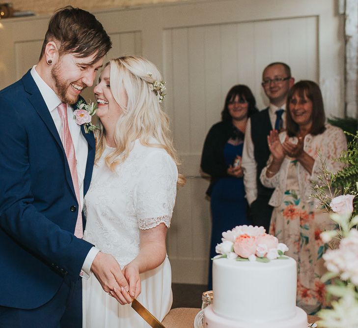 Cutting The Cake | Bride in Custom Made Separates | Groom in Next Suit | Pink & Gold Summer Wedding at East Riddlesden Hall Barn, Wiltshire | Laura Calderwoods Photography