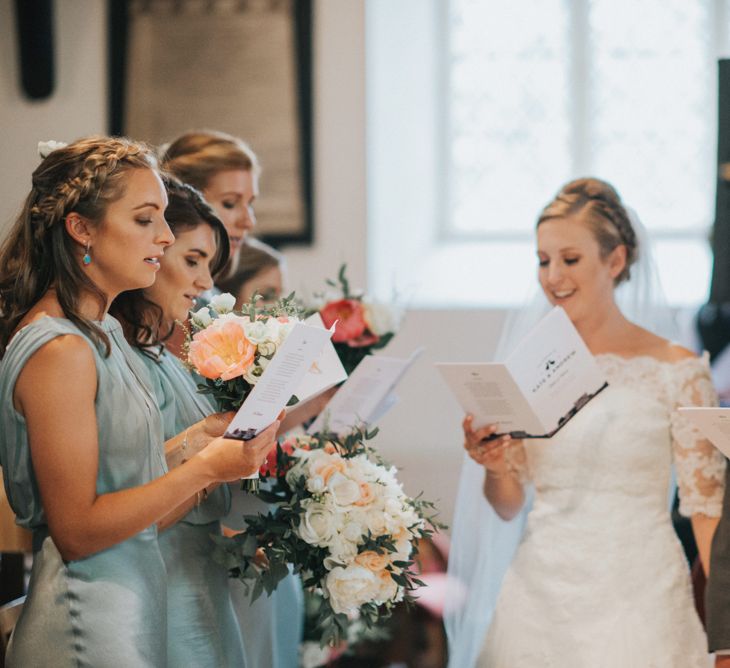 Church Wedding Ceremony with Bride in Pronovias White One Wedding Dress & Bridesmaids in Pale Green Claudia Ghost Dresses