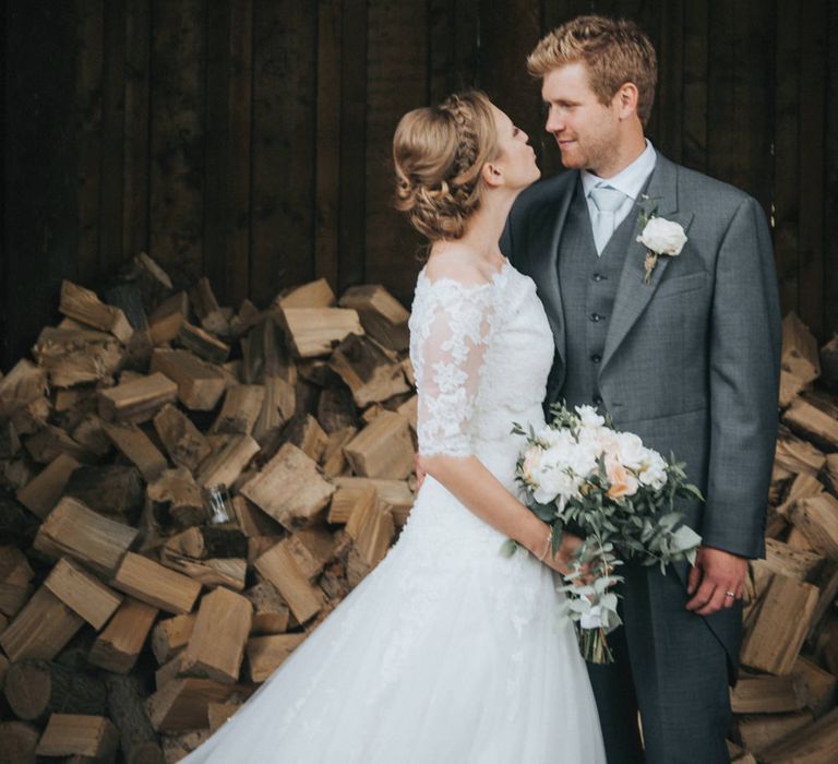 Bride in Pronovias White One Wedding Dress & Groom in Grey Morning Suit