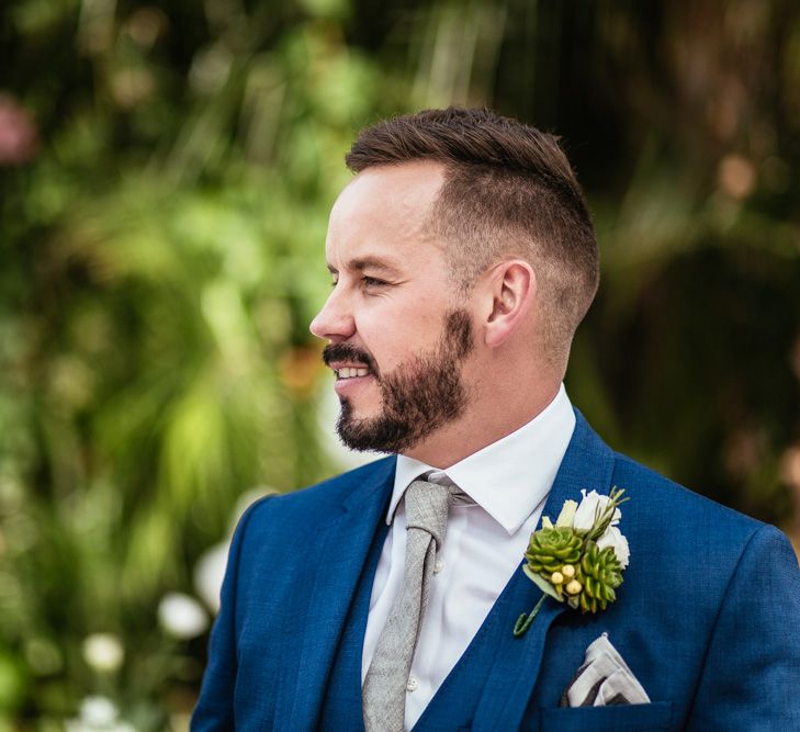 Groom in Navy Ted Baker Suit & Succulent Buttonhole