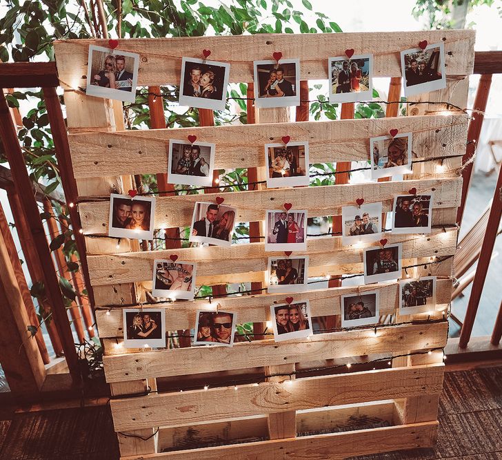 Polaroids On Wooden Palettes With Fairy Lights