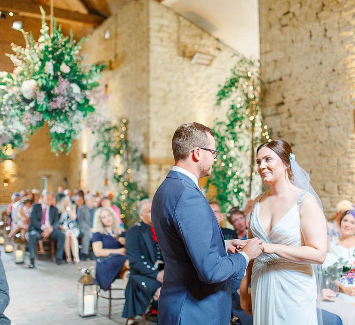 Barn Wedding Ceremony | Bride in Ellis Bridal Gown | Groom in Dyfed Menswear Navy Suit | Romantic Pastel Wedding at Cripps Barn | White Stag Wedding Photography | Dan Hodge Wedding Films