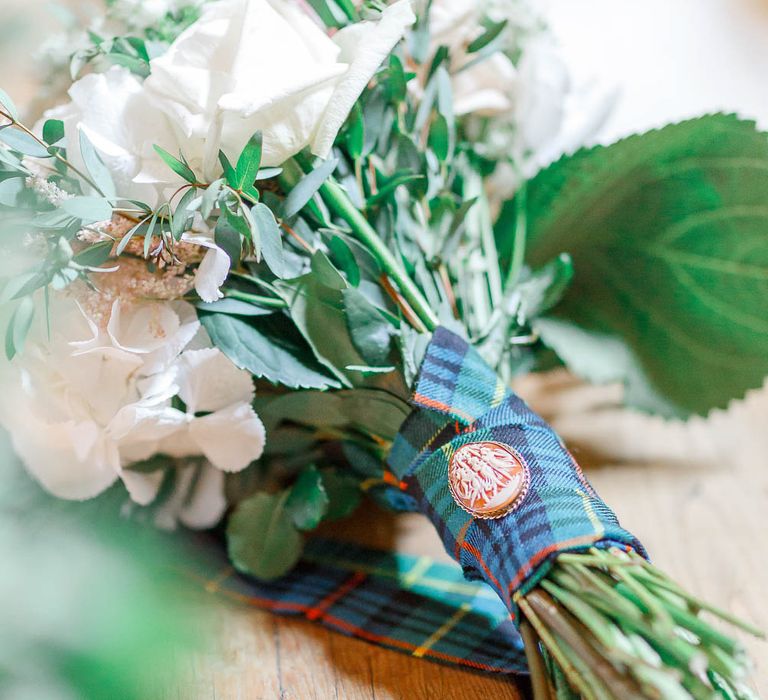 Tartan Ribbon & Cameo Brooch on Bouquet | Romantic Pastel Wedding at Cripps Barn | White Stag Wedding Photography | Dan Hodge Wedding Films