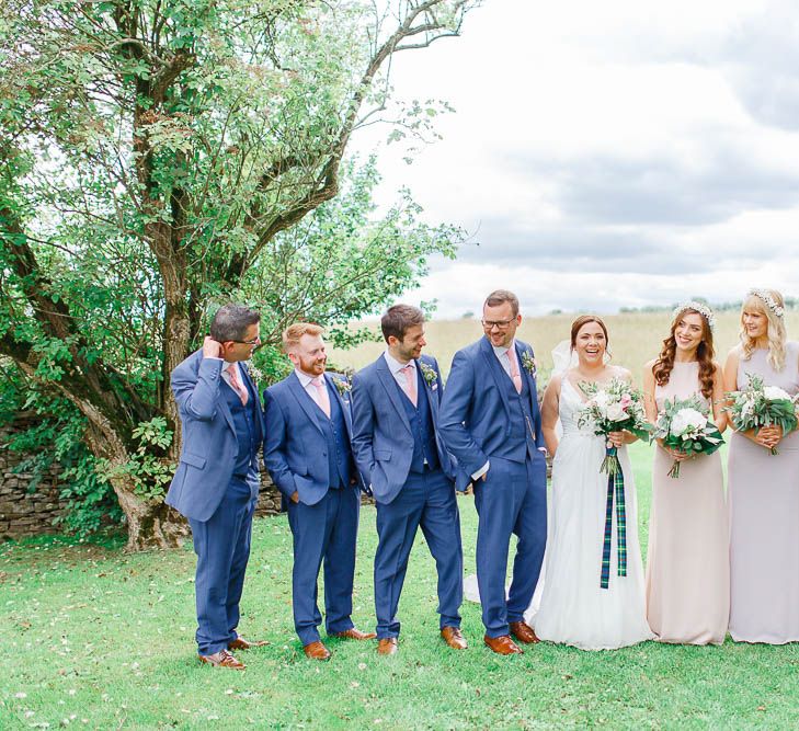 Wedding Party | Bride in Ellis Bridal Gown | Pink Hued ASOS Bridesmaid Dresses | Groomsmen in Dyfed Menswear Navy Suits | Romantic Pastel Wedding at Cripps Barn | White Stag Wedding Photography | Dan Hodge Wedding Films