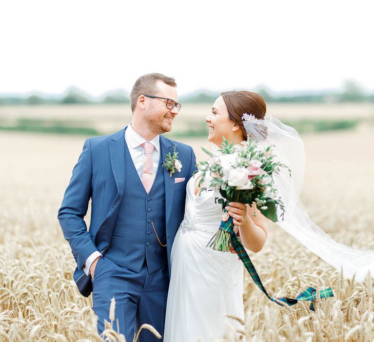 Bride in Ellis Bridal Gown | Groom in Dyfed Menswear Navy Suit | Romantic Pastel Wedding at Cripps Barn | White Stag Wedding Photography | Dan Hodge Wedding Films