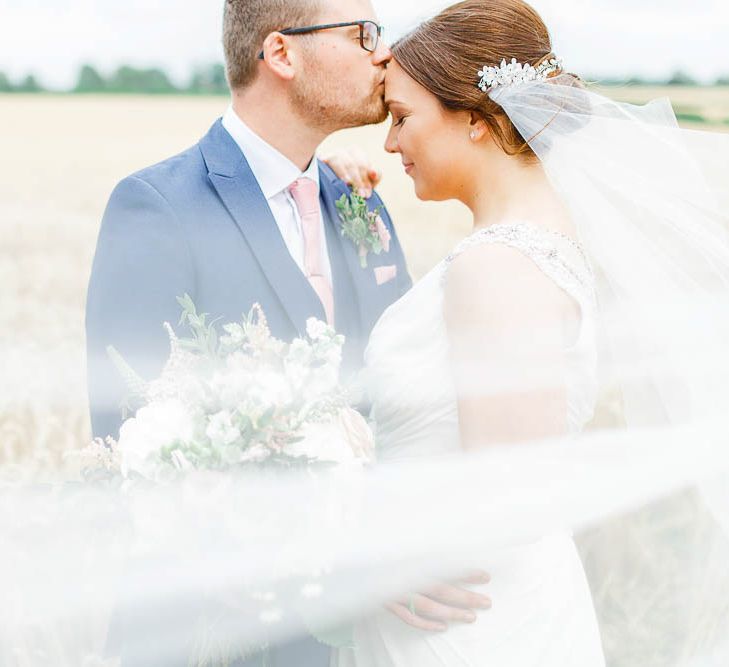 Bride in Ellis Bridal Gown | Groom in Dyfed Menswear Navy Suit | Romantic Pastel Wedding at Cripps Barn | White Stag Wedding Photography | Dan Hodge Wedding Films