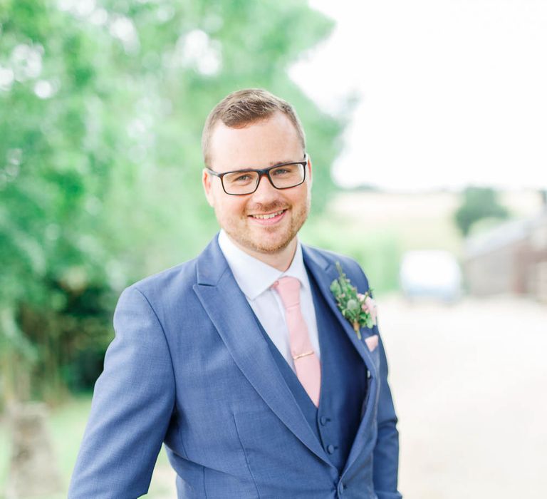 Groom in Dyfed Menswear Navy Suit | Romantic Pastel Wedding at Cripps Barn | White Stag Wedding Photography | Dan Hodge Wedding Films