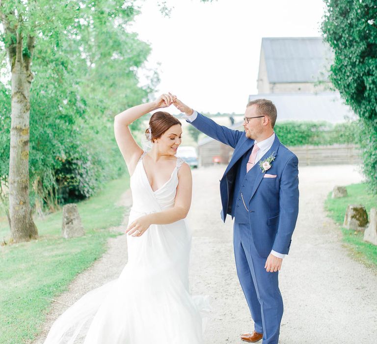 Bride in Ellis Bridal Gown | Groom in Dyfed Menswear Navy Suit | Romantic Pastel Wedding at Cripps Barn | White Stag Wedding Photography | Dan Hodge Wedding Films