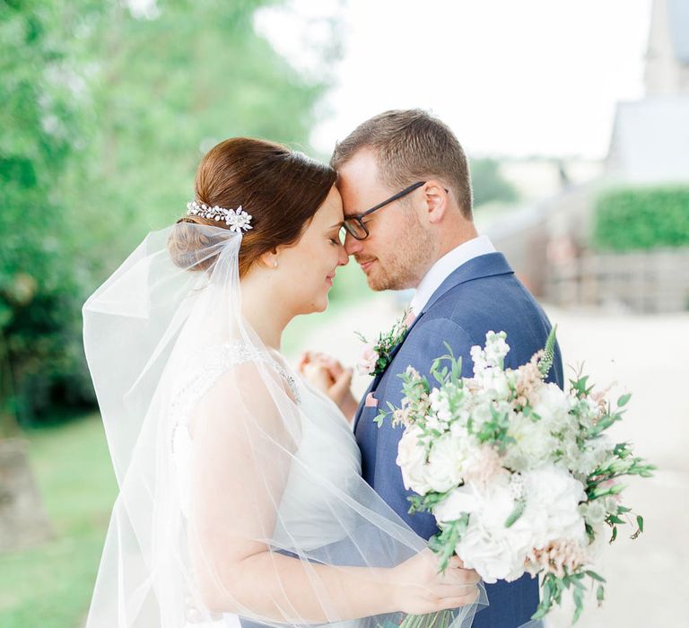 Bride in Ellis Bridal Gown | Groom in Dyfed Menswear Navy Suit | Romantic Pastel Wedding at Cripps Barn | White Stag Wedding Photography | Dan Hodge Wedding Films