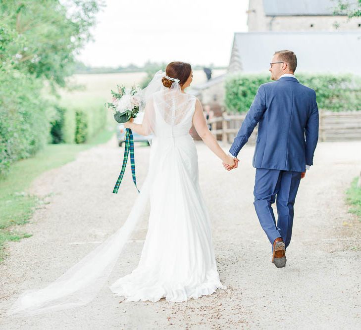 Bride in Ellis Bridal Gown | Groom in Dyfed Menswear Navy Suit | Romantic Pastel Wedding at Cripps Barn | White Stag Wedding Photography | Dan Hodge Wedding Films