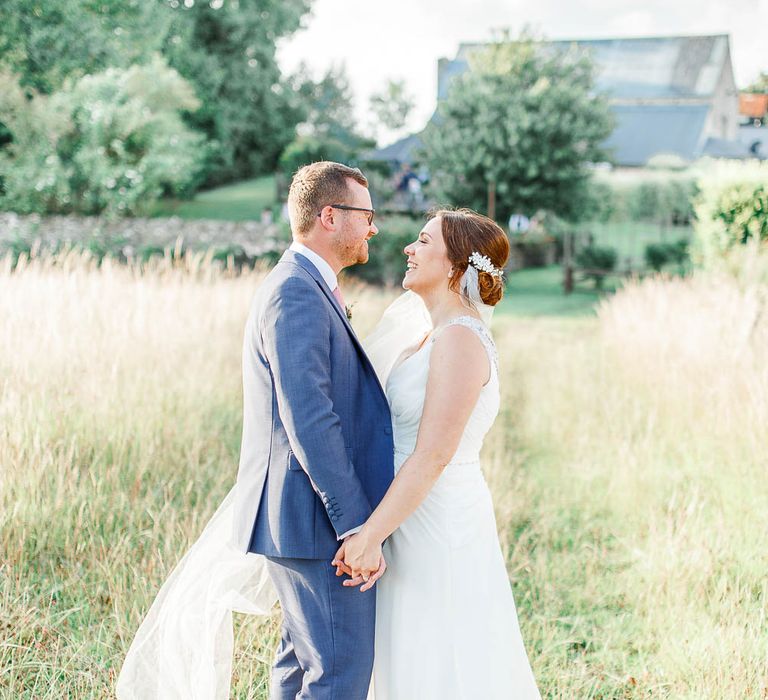 Bride in Ellis Bridal Gown | Groom in Dyfed Menswear Navy Suit | Romantic Pastel Wedding at Cripps Barn | White Stag Wedding Photography | Dan Hodge Wedding Films