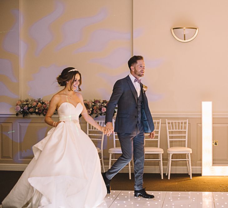 Dance Floor Lights | Bride in Ronald Joyce Bridal Gown | Groom in Grey Moss Bros Suit | The Orangery Maidstone | Lucie Watson Photography | TDH Media Films