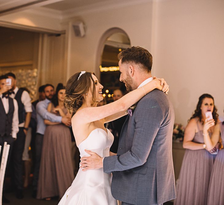 First Dance | Bride in Ronald Joyce Bridal Gown | Groom in Grey Moss Bros Suit | The Orangery Maidstone | Lucie Watson Photography | TDH Media Films