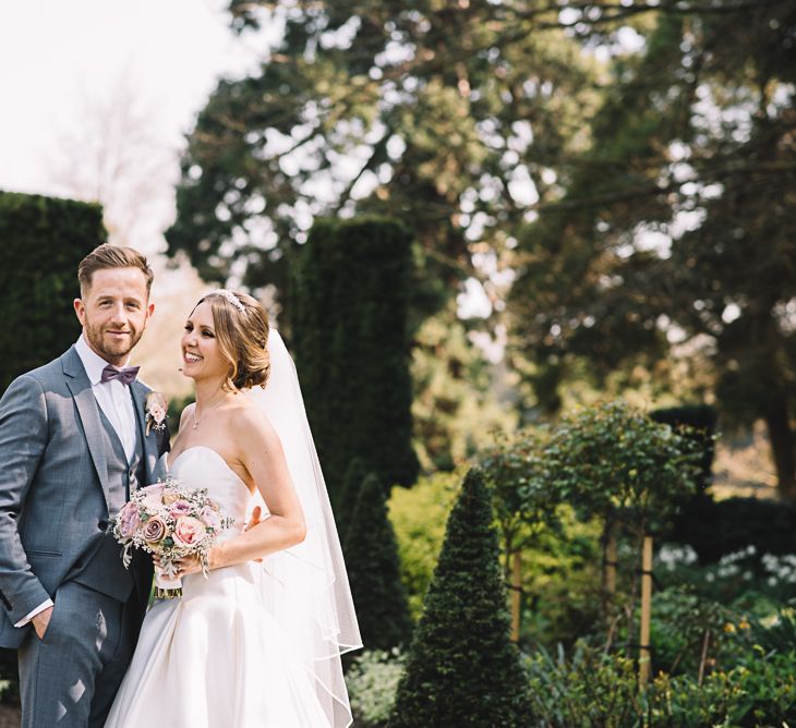 Bride in Ronald Joyce Wedding Dress | Groom in Grey Moss Bros Suit | The Orangery Maidstone | Lucie Watson Photography | TDH Media Films