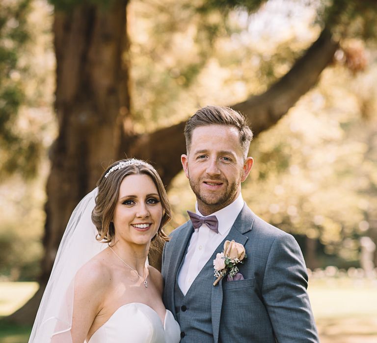 Bride in Ronald Joyce Wedding Dress | Groom in Grey Moss Bros Suit | The Orangery Maidstone | Lucie Watson Photography | TDH Media Films