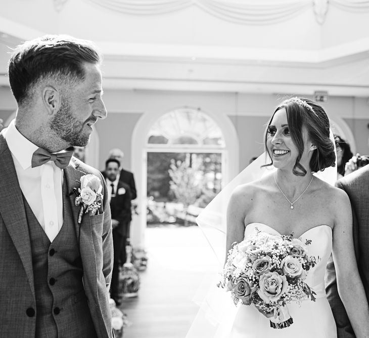 Wedding Ceremony | Bride in Ronald Joyce Wedding Dress | Groom in Grey Moss Bros Suit | The Orangery Maidstone | Lucie Watson Photography | TDH Media Films