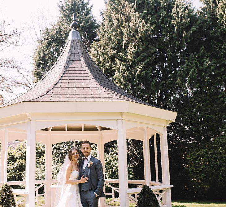 Bandstand | Bride in Ronald Joyce Wedding Dress | Groom in Grey Moss Bros Suit | The Orangery Maidstone | Lucie Watson Photography | TDH Media Films