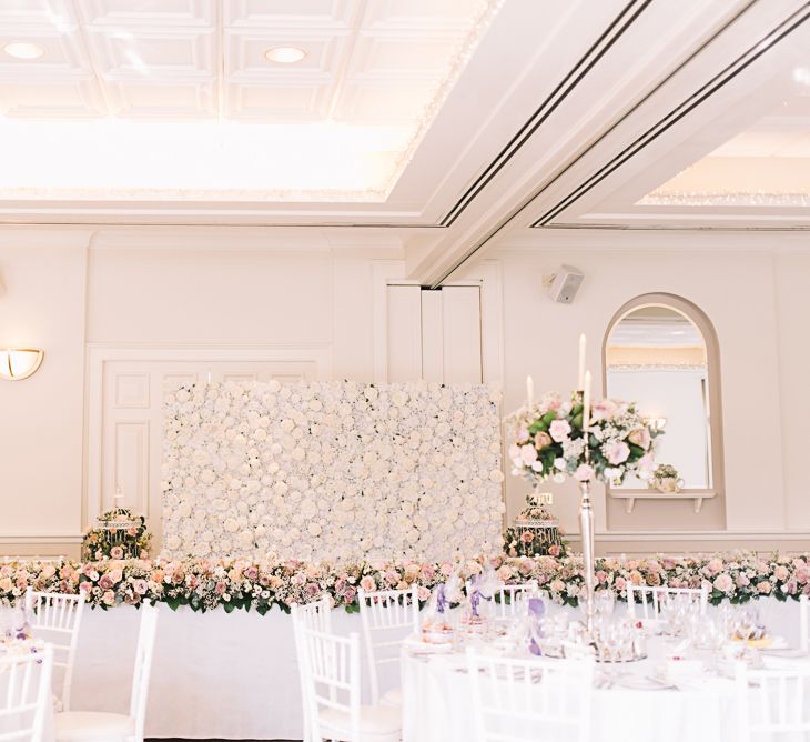 Flower Wall | Top Table Floral Table Runner | Candelabra & Flower Table Centrepieces | The Orangery Maidstone | Lucie Watson Photography | TDH Media Films