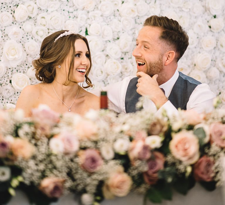 Top Table Decor | Bride in Ronald Joyce Wedding Dress | Groom in Grey Moss Bros Suit | The Orangery Maidstone | Lucie Watson Photography | TDH Media Films