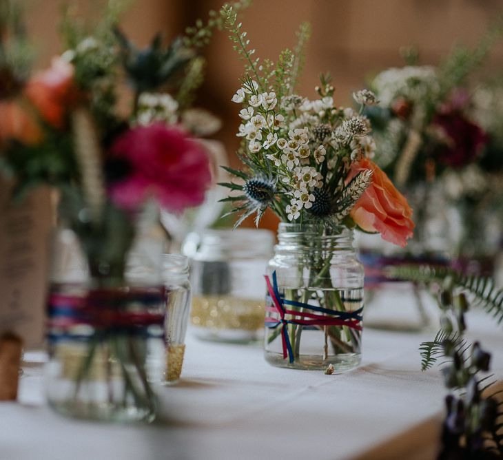 Jam Jar Flowers At Wedding