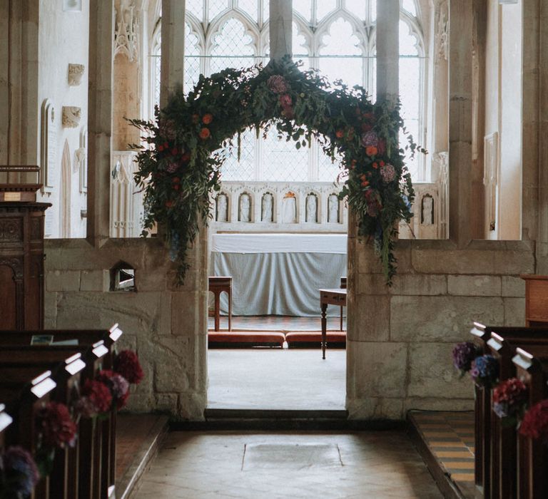 Floral Arch Church Flowers | Colourful DIY Barn Wedding at The Manor Barn, Cambridge | Meghan Lorna Photography