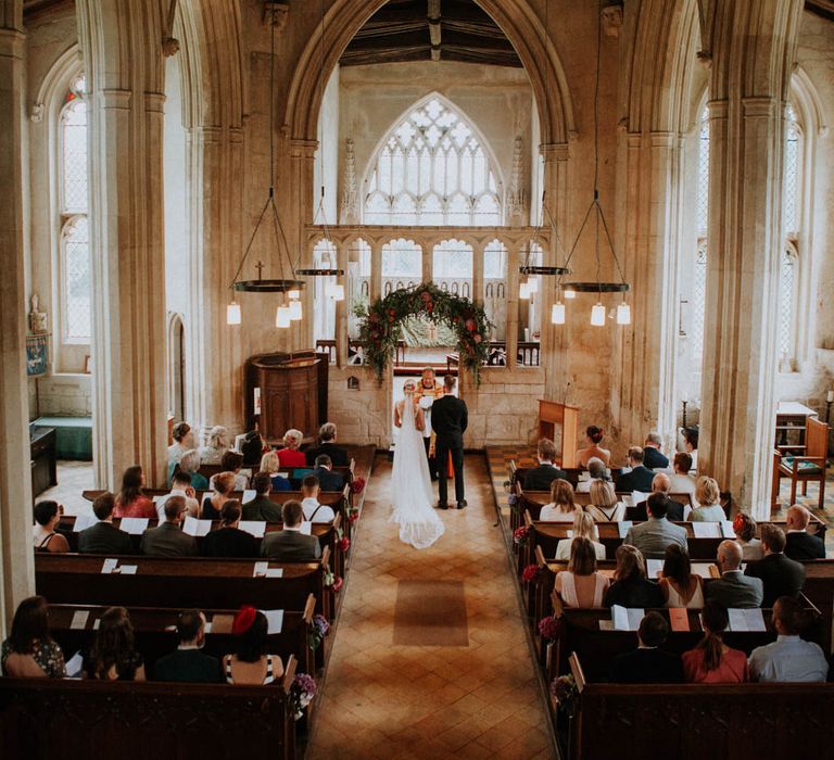 Church Wedding Ceremony | Bride in Lace & Tulle Gown | Groom in Black Suit & Liberty Print Bow Tie | Colourful DIY Barn Wedding at The Manor Barn, Cambridge | Meghan Lorna Photography