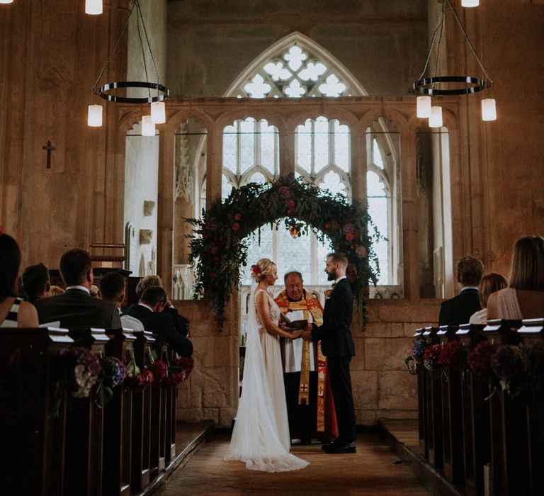 Church Wedding Ceremony | Bride in Lace & Tulle Gown | Groom in Black Suit & Liberty Print Bow Tie | Colourful DIY Barn Wedding at The Manor Barn, Cambridge | Meghan Lorna Photography