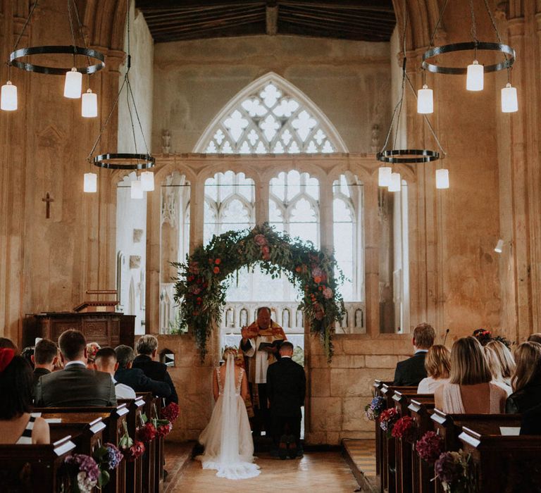 Church Wedding Ceremony | Bride in Lace & Tulle Gown | Groom in Black Suit & Liberty Print Bow Tie | Colourful DIY Barn Wedding at The Manor Barn, Cambridge | Meghan Lorna Photography