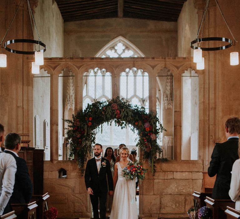 Church Wedding Ceremony | Bride in Lace & Tulle Gown | Groom in Black Suit & Liberty Print Bow Tie | Colourful DIY Barn Wedding at The Manor Barn, Cambridge | Meghan Lorna Photography