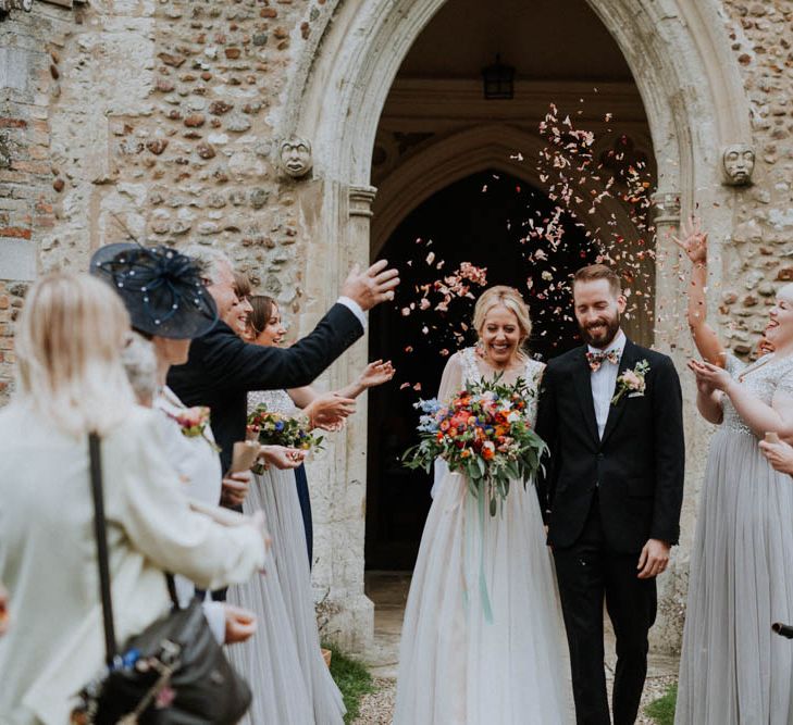 Church Wedding Ceremony | Bride in Lace & Tulle Gown | Groom in Black Suit & Liberty Print Bow Tie | Colourful DIY Barn Wedding at The Manor Barn, Cambridge | Meghan Lorna Photography