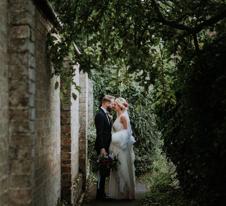 Bride in Lace & Tulle Gown | Groom in Black Suit & Liberty Print Bow Tie | Colourful DIY Barn Wedding at The Manor Barn, Cambridge | Meghan Lorna Photography