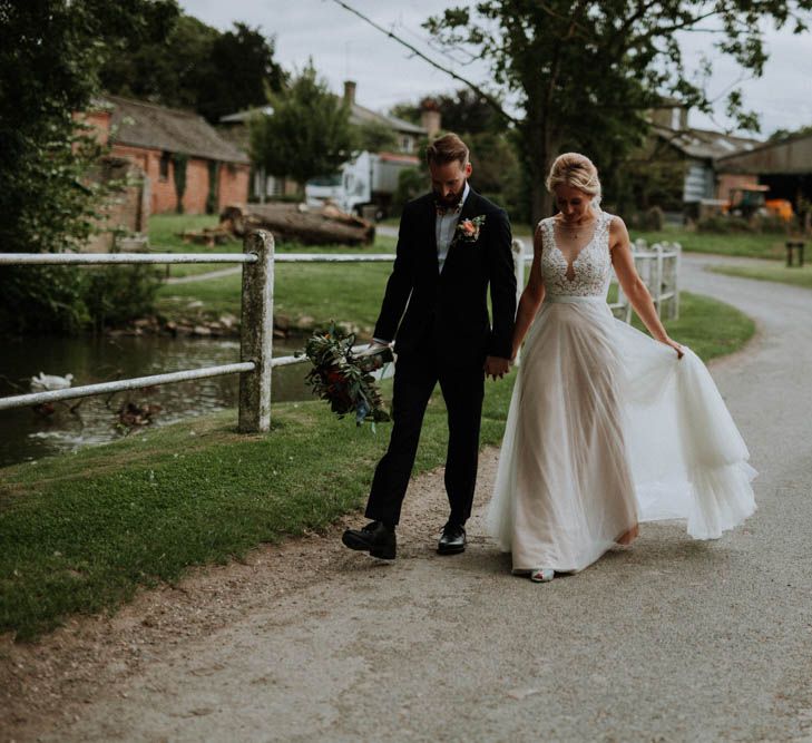 Bride in Lace & Tulle Gown | Groom in Black Suit & Liberty Print Bow Tie | Colourful DIY Barn Wedding at The Manor Barn, Cambridge | Meghan Lorna Photography