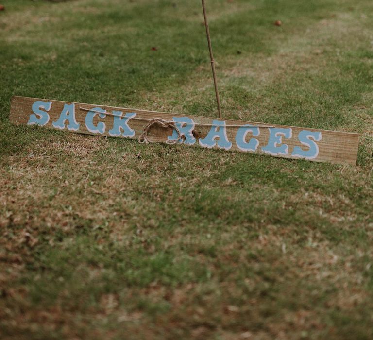 Sack Race Garden Games | Colourful DIY Barn Wedding at The Manor Barn, Cambridge | Meghan Lorna Photography