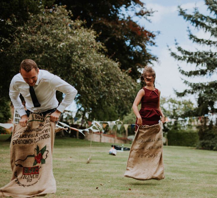 Sack Race Garden Games | Colourful DIY Barn Wedding at The Manor Barn, Cambridge | Meghan Lorna Photography