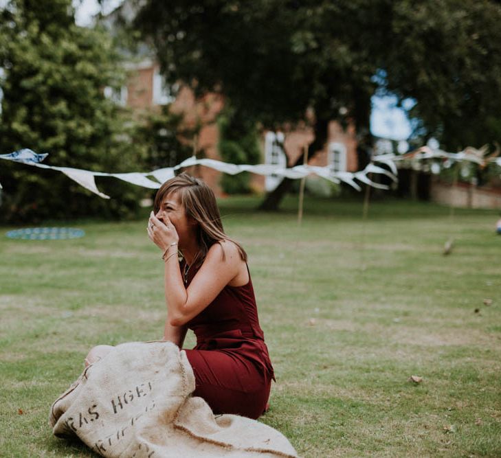 Sack Race Garden Games | Colourful DIY Barn Wedding at The Manor Barn, Cambridge | Meghan Lorna Photography