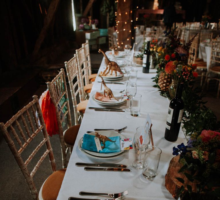 Spray Painted Dinosaur Place Setting | Colourful DIY Barn Wedding at The Manor Barn, Cambridge | Meghan Lorna Photography