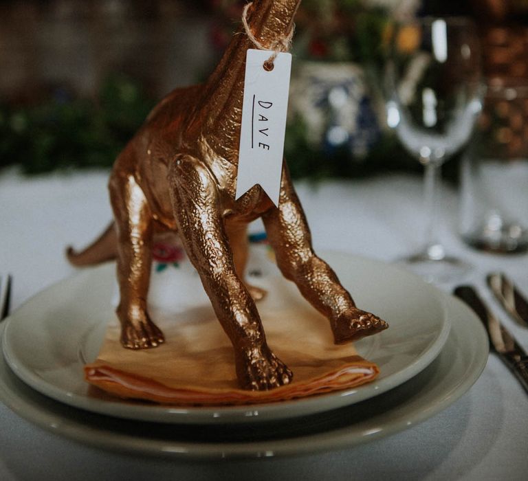 Spray Painted Dinosaur Place Setting | Colourful DIY Barn Wedding at The Manor Barn, Cambridge | Meghan Lorna Photography