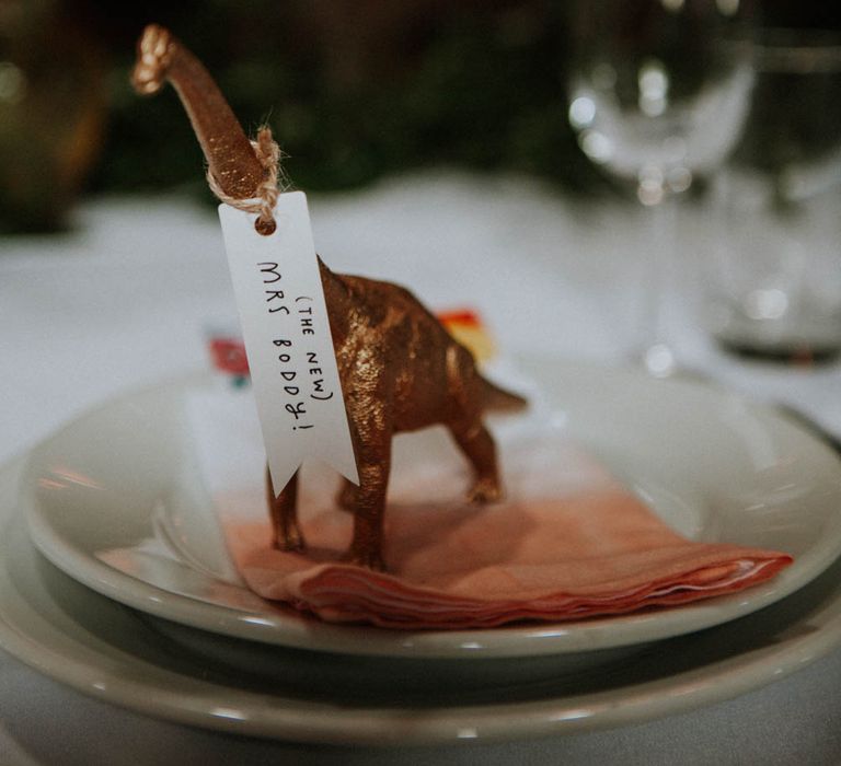 Spray Painted Dinosaur Place Setting | Colourful DIY Barn Wedding at The Manor Barn, Cambridge | Meghan Lorna Photography