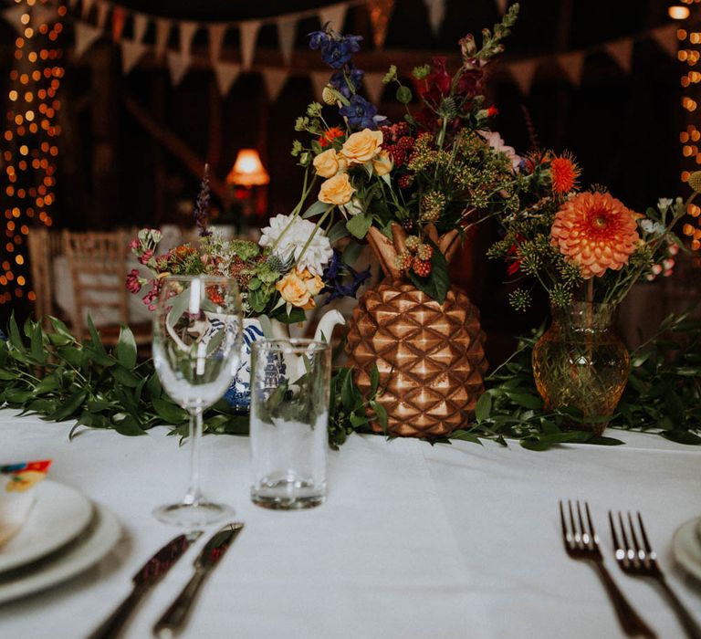 Flower Stems in Spray Painted Pineapple Centrepiece | Colourful DIY Barn Wedding at The Manor Barn, Cambridge | Meghan Lorna Photography