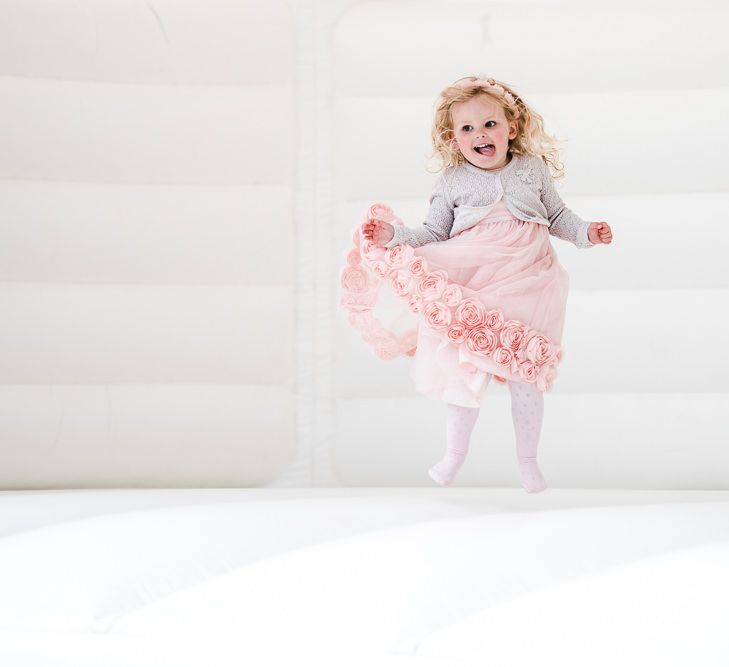 Bouncy Castle | PapaKåta Sperry Tent at Chafford Park in Kent Countryside | Eve Dunlop Photography | Roost Film Co.