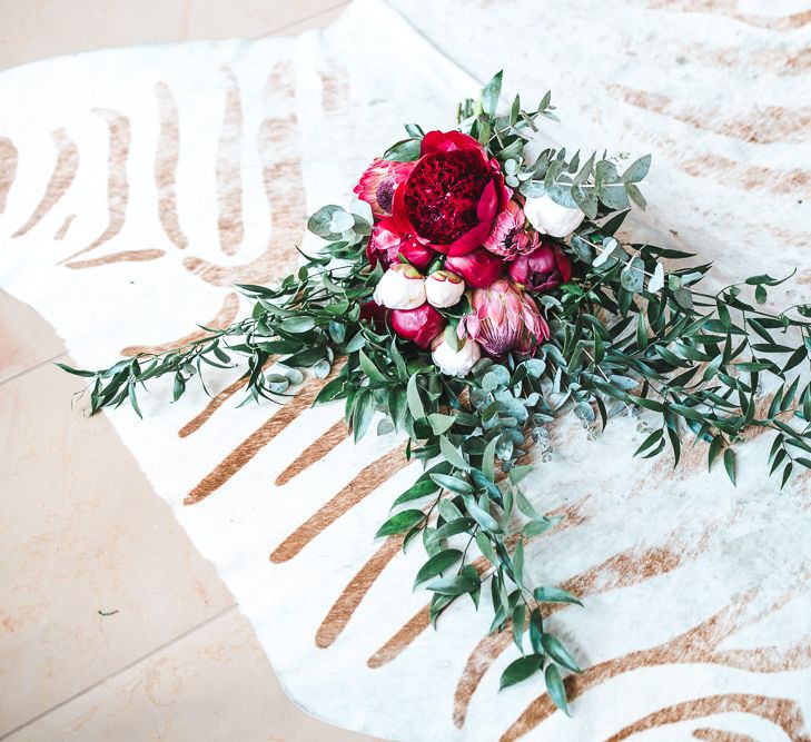 Deep Pink Peony & Protea Wedding Bouquet | PapaKåta Sperry Tent at Chafford Park in Kent Countryside | Eve Dunlop Photography | Roost Film Co.