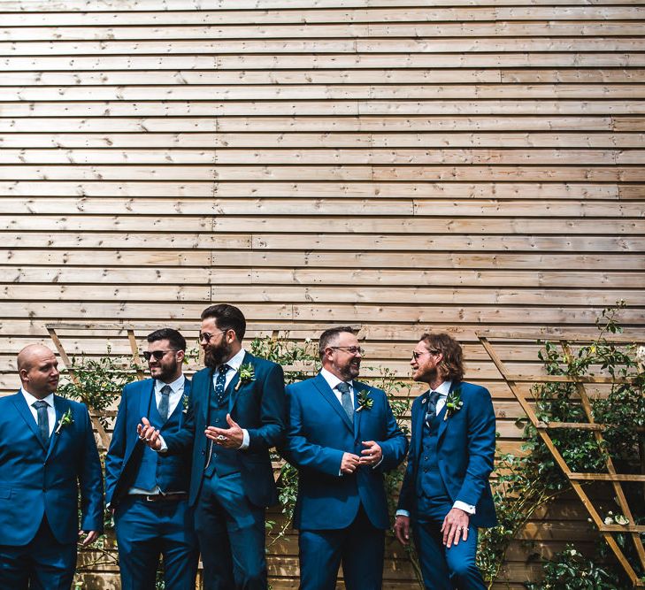 Groomsmen in Navy Suits | PapaKåta Sperry Tent at Chafford Park in Kent Countryside | Eve Dunlop Photography | Roost Film Co.